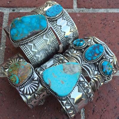 Massive sterling silver cuffs featuring rare turquoise from southwestern states