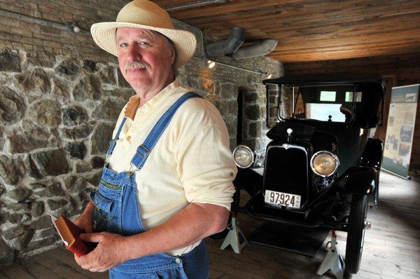 Mr. Gertz, Lindbergh tenant farmer, with the Lindbergh's 1916 Saxon.