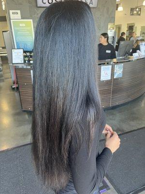 blow dried her curly hair straight