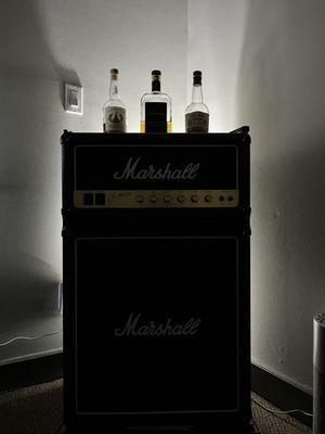 Marshall speaker fridge with complimentary beverages.