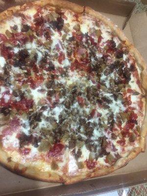 Halal meat lover's pizza with halal steak, pepperoni, sausage and beef bacon