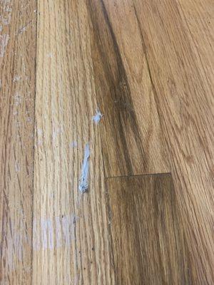 Adhesive on my hardwood floors once again stripping the finish off