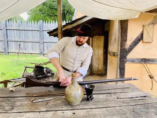 Actor cleaning his musket