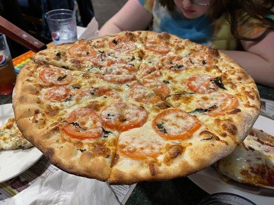 White pizza with tomato and basil