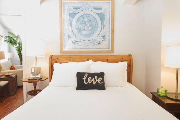 The bedroom of the Pineapple Suite at Burns Square Historic Vacation Rentals.