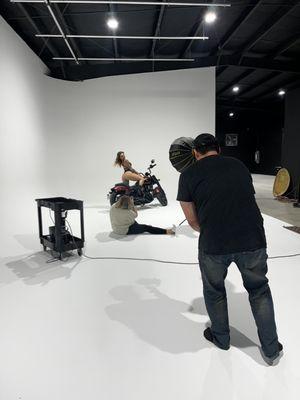 Shots Fired Photostyling shooting an awesome set Emerald Elements that features an Indian Motorcycle on the cyc wall.