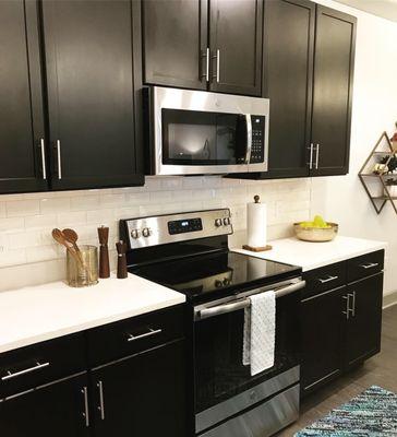 Kitchen with Stainless Steal Appliances & Quartz Countertops