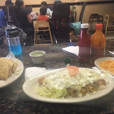 Quesadillas on the left, and taquitos  in the middle, rice on the right.