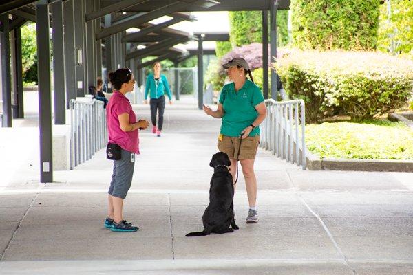 Trainers and staff in the outdoor breezeway on the Boring, OR campus