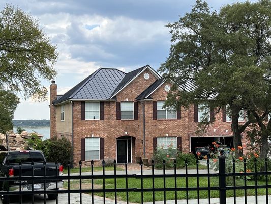 Matte Black Striated Standing Seam 24 gauge Metal Roof on Lake House