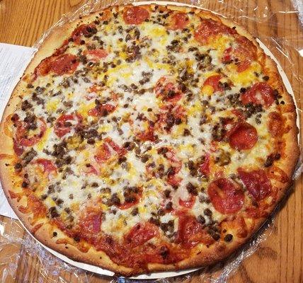 A pepperoni and beef pizza after baking