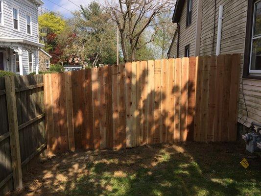 Western Red Cedar dog eared privacy fence.