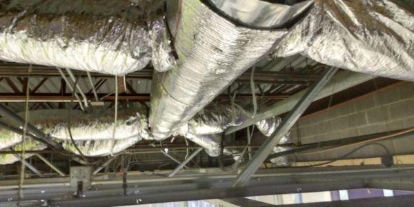 Ductwork installed above a dropped ceiling on a commercial application