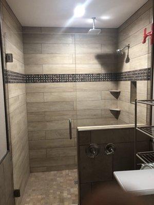 New walk in shower with dual shower heads. Control valves on exterior of shower.