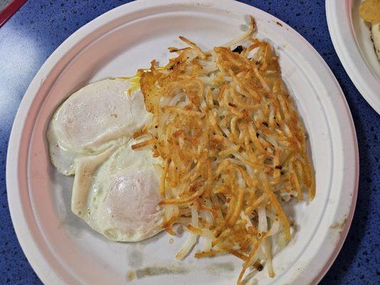 Eggs over medium y hashbrowns part of the chicken fried steak plate