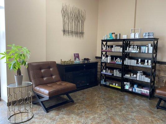 Cozy, spacious, clean, and comfortable waiting area with extensive retail of the Dermalogica skin care line