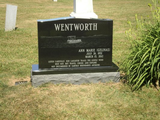 Black Granite all polished Family memorial with laser etching.