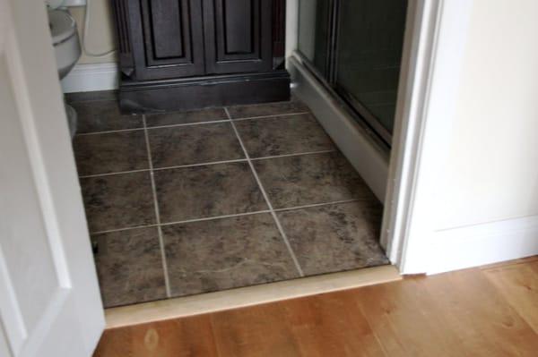 tile and wood  floor by Bay Cities Floor Covering.