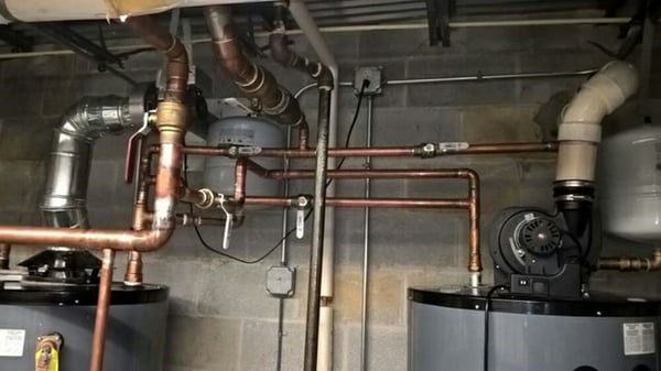 Water heaters piped in series