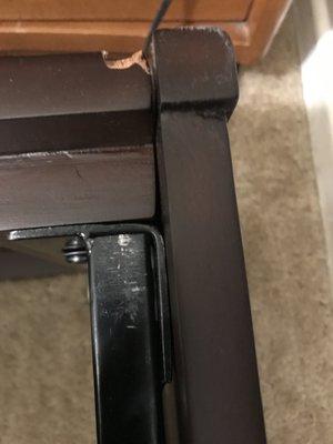 Scratches on metal, missing piece of wood on left side rail.