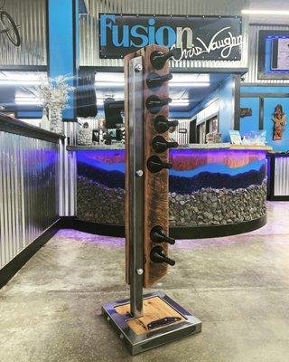 Sleek, one of a kind industrial steel and reclaimed oak wine rack.