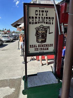 Street sign and ice cream being made fresh!