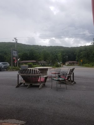 Front porch tables facing road. Lovely.