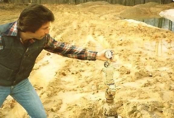 CEO Stephen Thompson reading pressure at the well head, WV, 1976