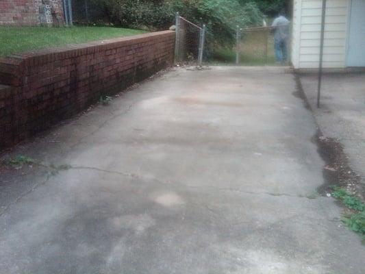 Before: retaining wall and driveway