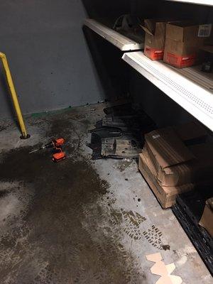 Skid plates in the corner, no other cars in the shop.