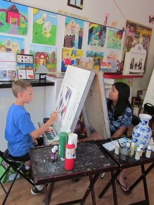 students painting in the studio