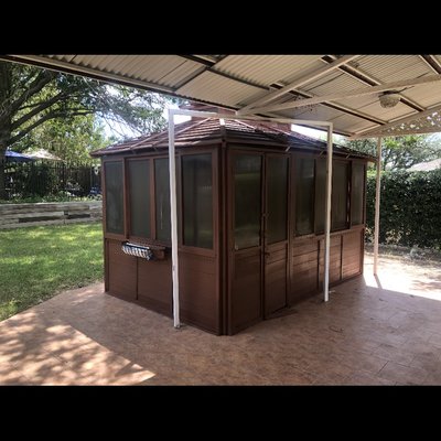 Wood repair and new stain on an Old gazebo turned it into a nice personal spa.