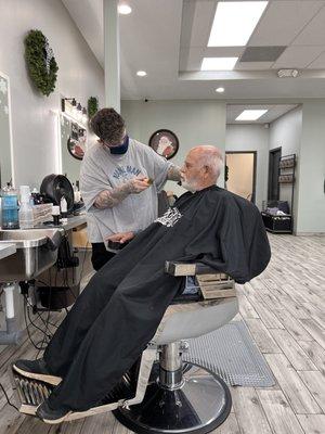 Pops getting his hair trimmed.