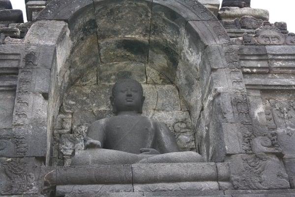 One of the thousands of Buddhas at Borobudur, Indonesia