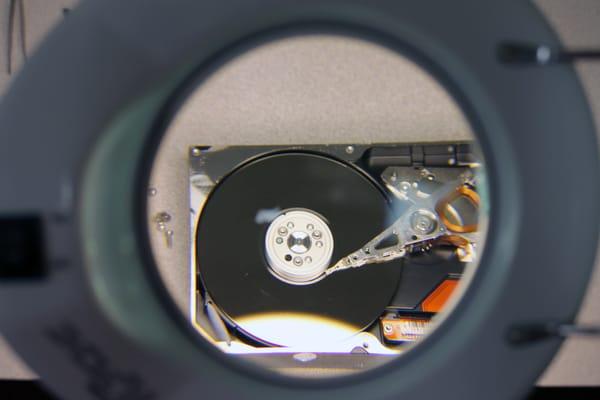 Failed Hard Drive is Opened in a Cleanroom at ACE Data Recovery Houston Lab