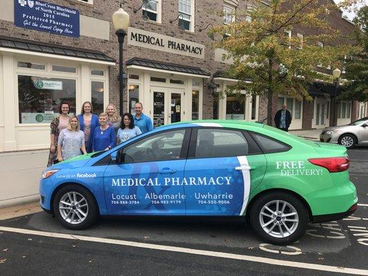 Our wonderful staff and delivery car in front of our store located in Locust town center!!