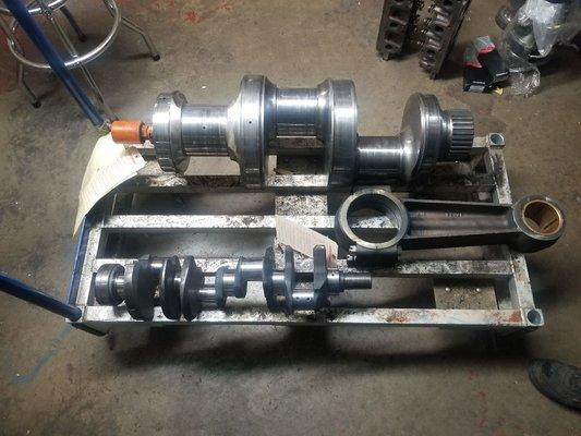 In house crank grinding! no job to big or small. Oilfeild pump shaft bext to a big block chevy for comparison.