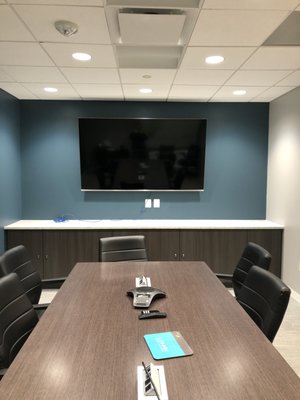 TV wall mounted in a conference room.