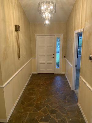 Amazing transformation of our parents lake house . This is the before foyer image