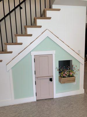 How cute is this playroom built under the stair case??