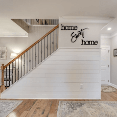 Shiplap wall treatment and sign.