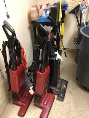 Vacuums in janitorial closet