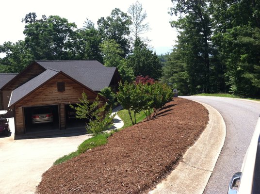 mulching off steep bank with mulch blower