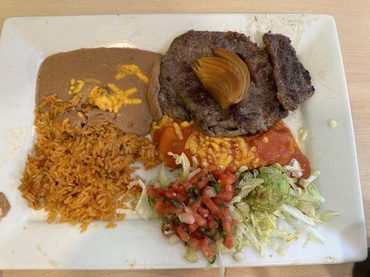 Carne Asada with enchilada  And steak and mushroom dish