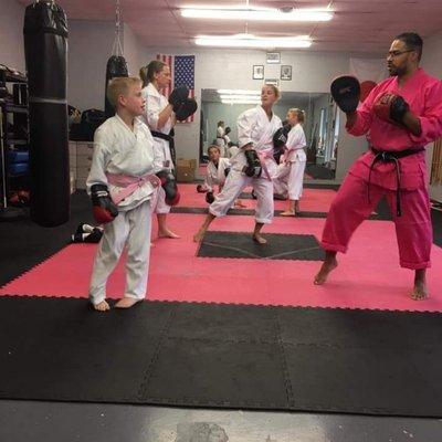 Thomas Karate Academy able to donated 460 dollars for  Breast Cancer Awareness Month..