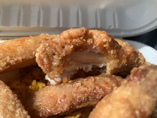 Fried chicken wings, shrimp fried rice no onions with bean sprouts