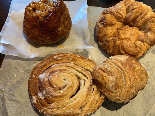 Macadamia sticky bun, Parmesan Amann, spicy pork w/jalapeño croissant and cinnamon roll Danish (clock wise from top left)