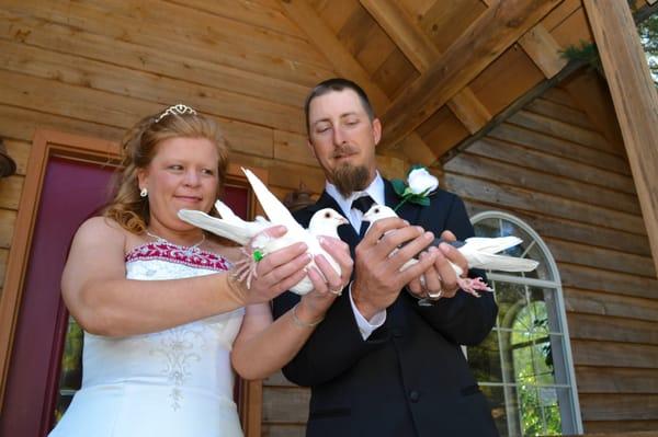 The "His & Her" Dove Release includes one White Dove (symbolizing the Bride) and one Tuxedo Dove (symbolizing the Groom).