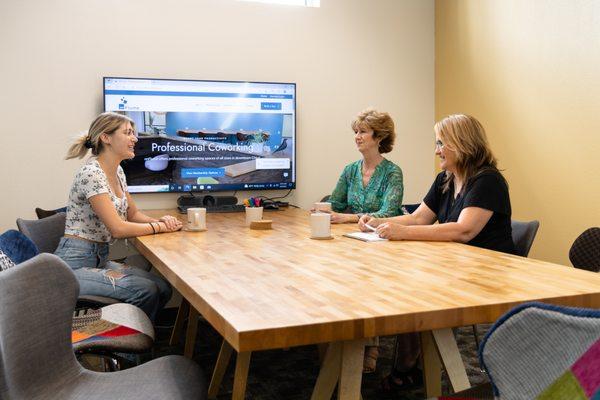 Conference room with whiteboard, smart TV. Seats up to 12. Can be reserved by non-members