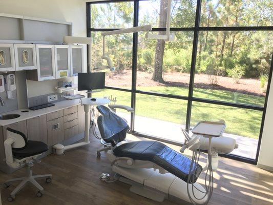 Treatment room with lots of natural lighting. We provide a television and personal headphones for your comfort while we take care of you.